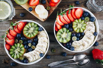 Healthy breakfast bowl oatmeal with blueberry, strawberry, kiwi, banana and chia seed.