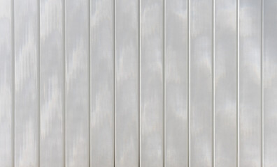 Texture of a translucent modern white synthetic or glass facade.