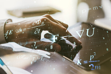 Creative scientific formula concept with finger clicks on a digital tablet on background....