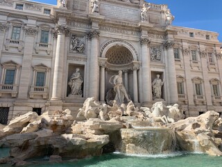 Running water at Fontana di Trevi (The Trevi fountain) at the city centre of Roma. It is famous sightseeing place and tourists attraction. Baroque style fountain. Rome, Lazio, Italy.