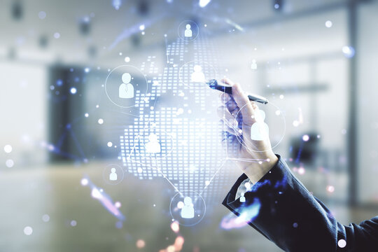 Man hand with pen working with virtual social network hologram and world map on blurred office background. Multiexposure - Powered by Adobe