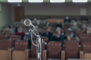 a wired microphone on a stand is installed on the stage