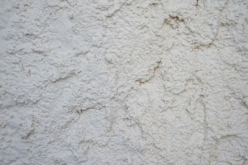 Aged, rough, white wall. Horizontal background.