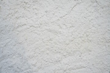 Aged, rough, white wall. Horizontal background.