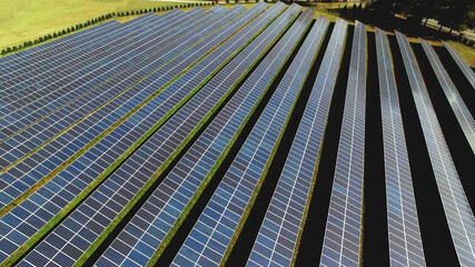 Drone high angle view of solar energy photovoltaic PV panels background. - 452168494