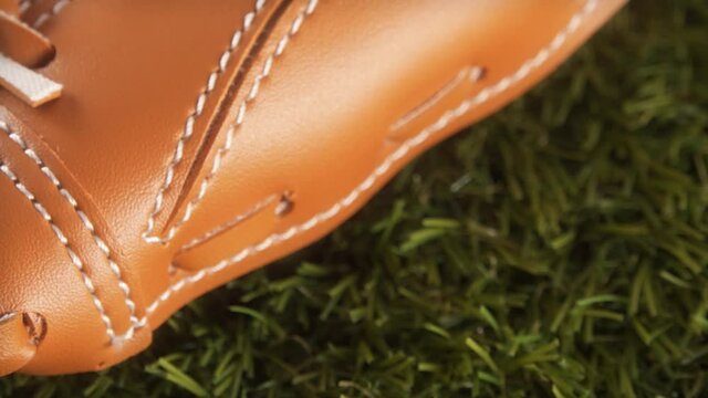 Baseball Glove On Grass Extreme Close Up With A Sliding Camera Move Stock Footage