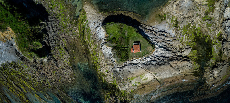 
aerial view of the hermitage of Carmen on the beach of aramar, luanco, asturias, spain
