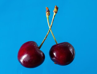 Ripe cherries on a solid background, healthy vegetarian food. Beautiful