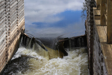 water flowing over the dam