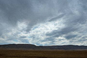 Fototapeta na wymiar Nature of the Kazakhstan Republic, steppes and hills, mountains and sky