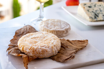 Cheese collection, semi-hard French blue cheese roquefort from Roquefort-sur-Soulzon, France served with sweet cold white french wine
