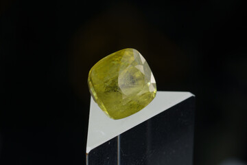 Natural gemstone sphene on black background