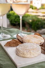 Cheese collection, semi-hard French blue cheese roquefort from Roquefort-sur-Soulzon, France served with sweet cold white french wine