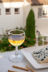 Cheese collection, semi-hard French blue cheese roquefort from Roquefort-sur-Soulzon, France served with sweet cold white french wine