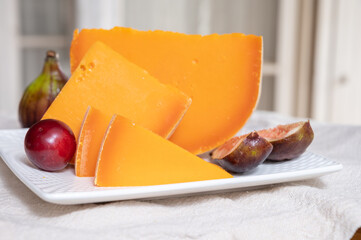 Cheese collection, French cheese mimolette made from cow milk served with fresh figs