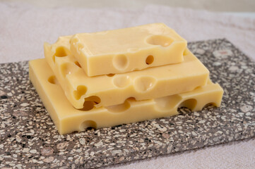 Cheese collection, semi-hard French cheese emmentaler with round holes made from cow milk