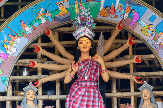Idol of Goddess Devi Durga at a decorated puja pandal in Kolkata, West Bengal, India. Durga Puja is a popular and major religious festival of Hinduism that is celebrated throughout the world.