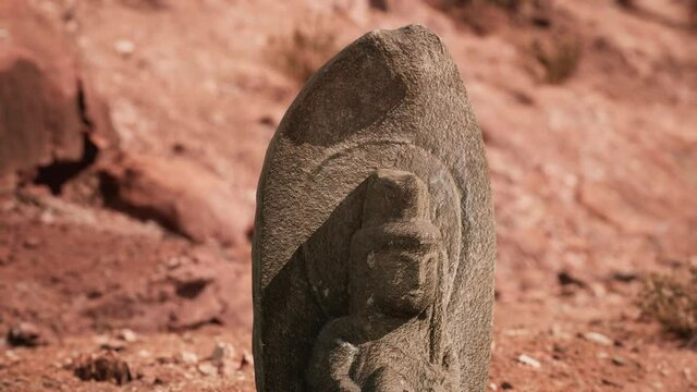 Ancient Statue on the Rocks Desert