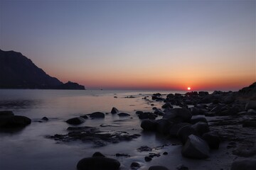 Fototapeta na wymiar Sunrise over the Foxi Manna beach in Tertenia. Sardinia, Italy