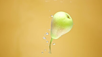 Yellow pear falls down into clear water with splash and makes big bubbles of air on light beige background macro slow motion - Powered by Adobe