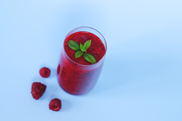 Top view of fresh delicious smoothie in a glass made of berries, chia seeds with mint. Creative concept of healthy detox drink, diet or vegetarian food concept. Copy space.