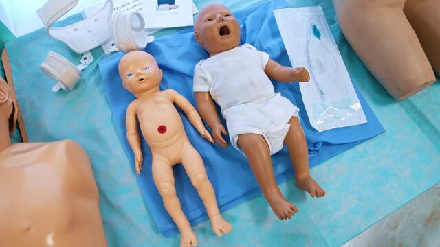 Baby dolls for medical practice. Child dummies on the table for students studying purpose in medical university.