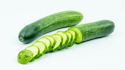 Vegetables, fruits, cucumbers and slices isolated on white background.