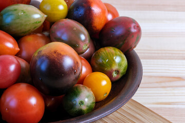 Fototapeta na wymiar Ripe sweet small tomatoes