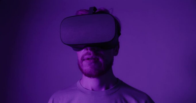 A red-haired guy in virtual reality glasses