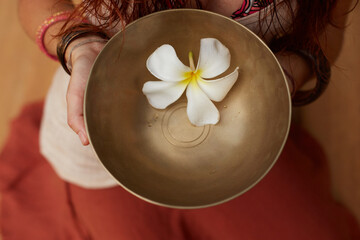 Tibetian singing bowl in a woman hands