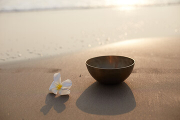 Singing tibetian bowl sea background