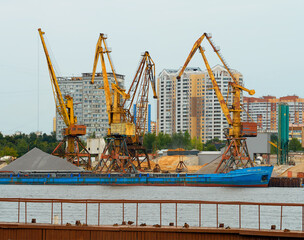 Naklejka premium Cargo loader at Moscow port delivery background