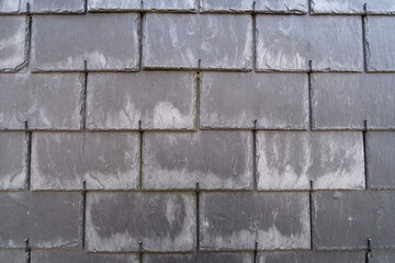 Close up of an old tiled wall in Honfleur, France, for an abstract background texture.