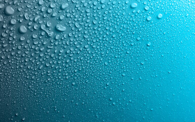 Water drops on smooth surface, blue background