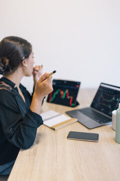 Young Investor Woman Eating Chocolate