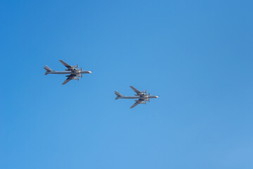 Military aircraft bombers in flight in the sky.