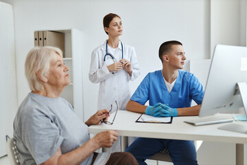 nurse and doctor examining a patient Health hospital
