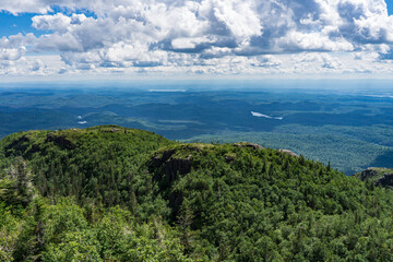 Obraz premium View on Saguenay on a summer day from the top of Pic de la Hutte, a peak located in Monts Valin National Park (Quebec, Canada)