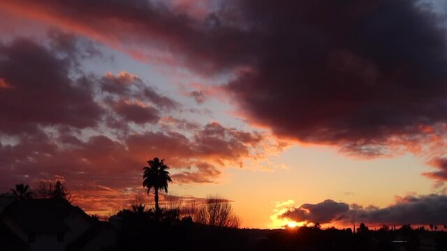 A Beautiful and Drastic Dramatic Sunset with Dynamic Orange Clouds