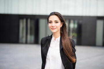 Smiling businesswoman in a city