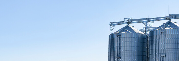 View of the modern outdoor grain storage silos. Background agriculture. Space for your text © MTX