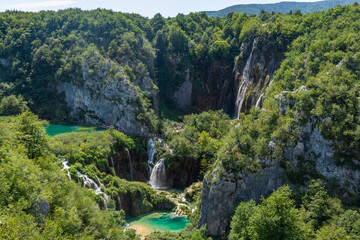 Little colorful lake and beautiful waterfalls in Plitvice Lakes National Park, Croatia