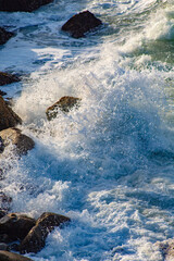 waves breaking on rocks