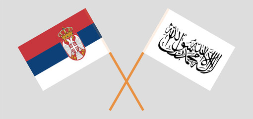 Crossed flags of Serbia and Islamic Emirate of Afghanistan. Official colors. Correct proportion