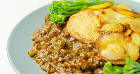 Minced beef hotpot, tender british beef in a warming gravy with carrots and peas, all topped with sliced roast potatoes