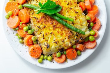 Shepherd's pie, tender minced lamb with garden veg in a hearty gravy beneath butter mash with carrots and green peas