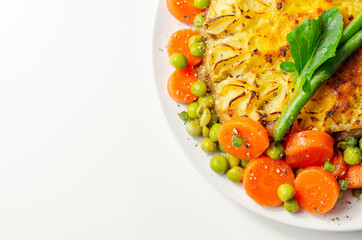 Shepherd's pie, tender minced lamb with garden veg in a hearty gravy beneath butter mash with carrots and green peas