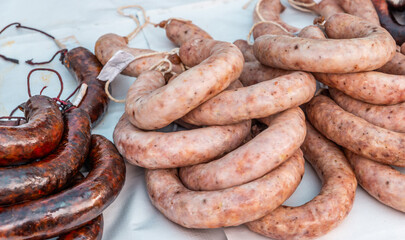Typical Spanish sausages lying on a village stall at the food market