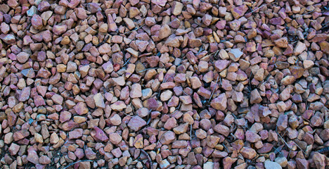 Pinkish-Brown Rocks On Ground