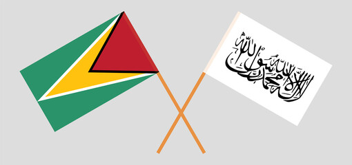 Crossed flags of Guyana and Islamic Emirate of Afghanistan. Official colors. Correct proportion